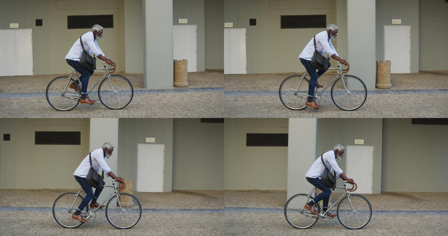 非裔美国老人在公司园区骑自行车