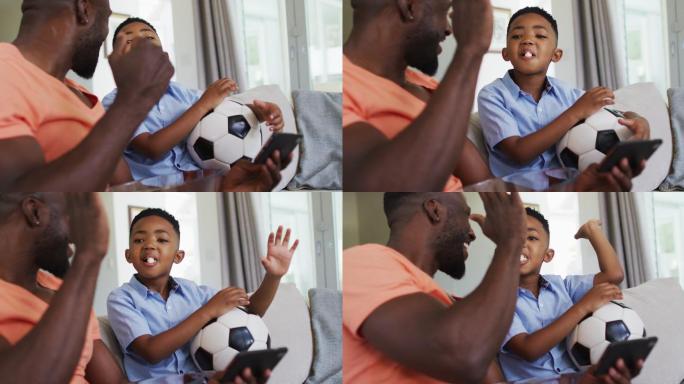 一对非裔美国父子一边吃着爆米花一边用智能手机看橄榄球赛