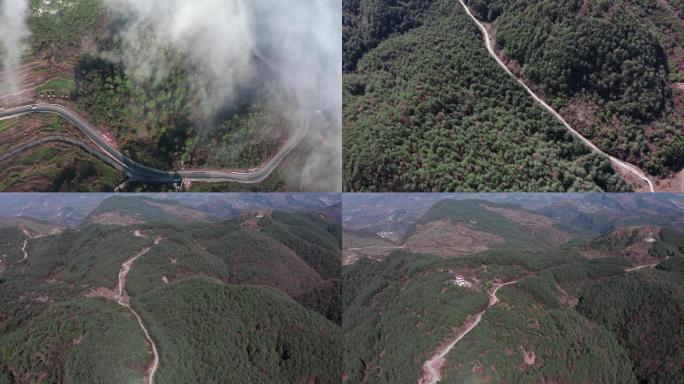 云雾中贫困地区高山道路航拍乡村旧貌