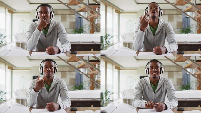 非裔美国男性青少年戴着耳机进行视频交谈