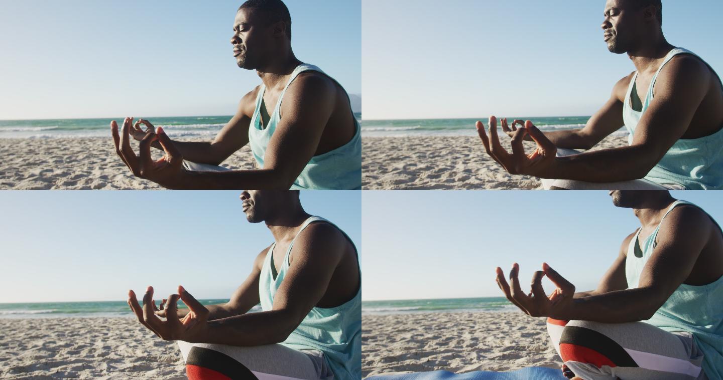 非裔美国人在海滩上练习瑜伽，在海边做户外运动