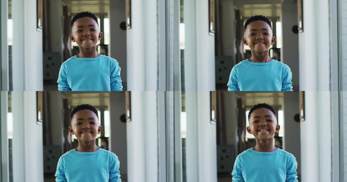 非裔美国人站在家里微笑的肖像
