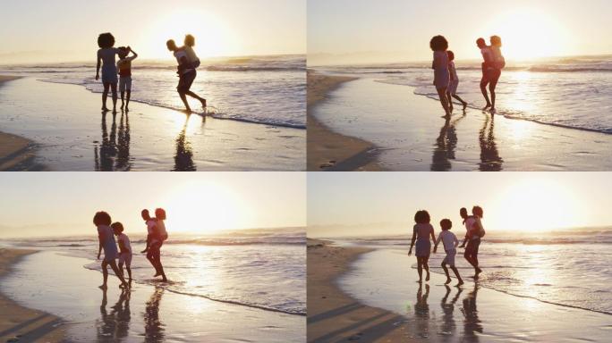 非裔美国家庭在日落时在海滩上一起玩乐