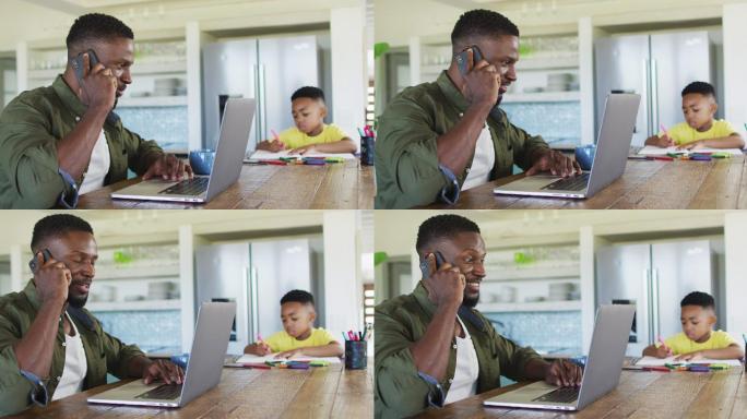 一对非裔美国父子在做作业，一边用智能手机聊天，一边用笔记本电脑