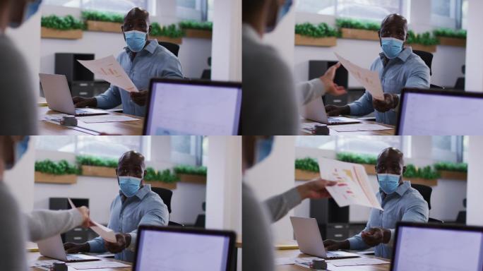 各种各样的男性和女性业务同事戴着口罩，在办公室用笔记本电脑传递文件