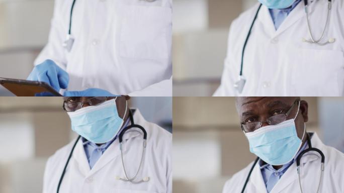 非裔美国资深男医生穿着白大褂使用数码平板电脑