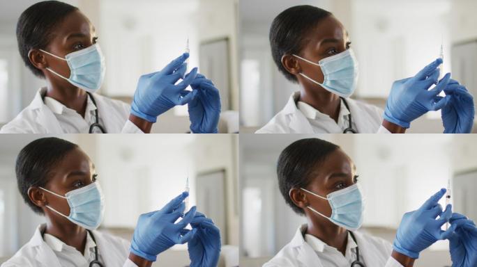 非裔美国女医生戴口罩为患者准备新冠疫苗