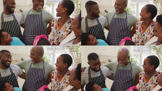 非裔美国家庭的三代人一起在家里的厨房里微笑