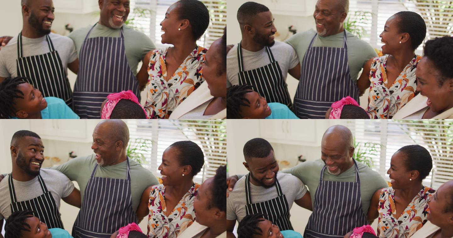 非裔美国家庭的三代人一起在家里的厨房里微笑
