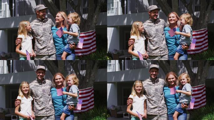 穿着制服的白人军人和他的家人在花园里微笑的肖像