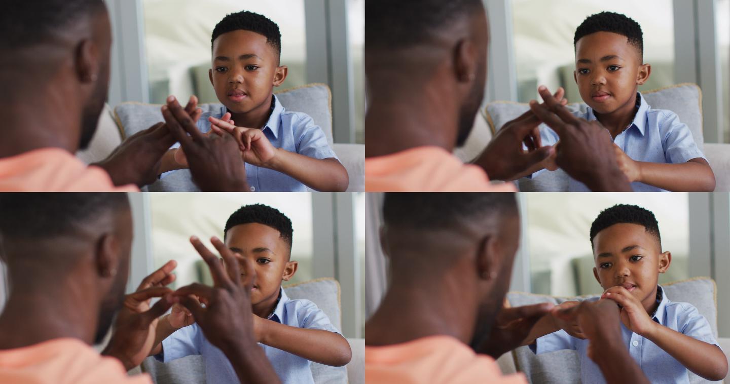 非裔美国父亲教儿子手语