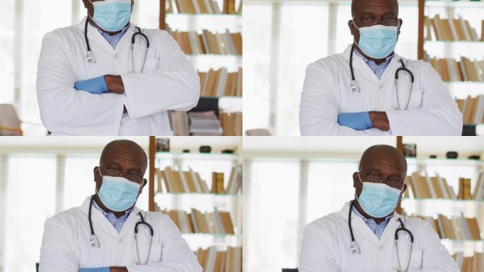 非裔美国资深男医生身穿白衣，双臂交叉望着镜头