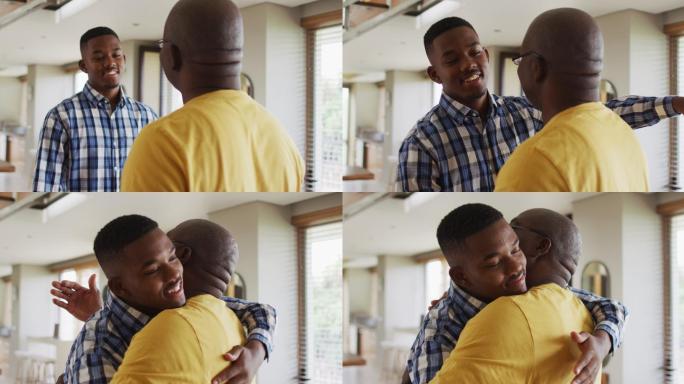 快乐的非裔美国父亲微笑着拥抱他十几岁的儿子