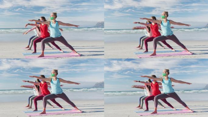 一群不同类型的女性朋友戴着口罩在海滩上练习瑜伽