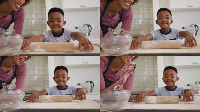 非裔美国母亲和儿子在家里的厨房里一起烘焙