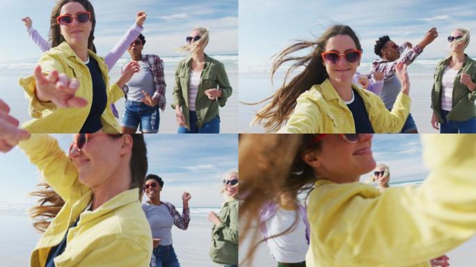 一群快乐的女性朋友在沙滩上嬉戏、跳舞、微笑