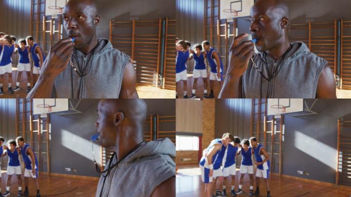 非裔美国男篮球教练使用口哨和他的球队在背景中