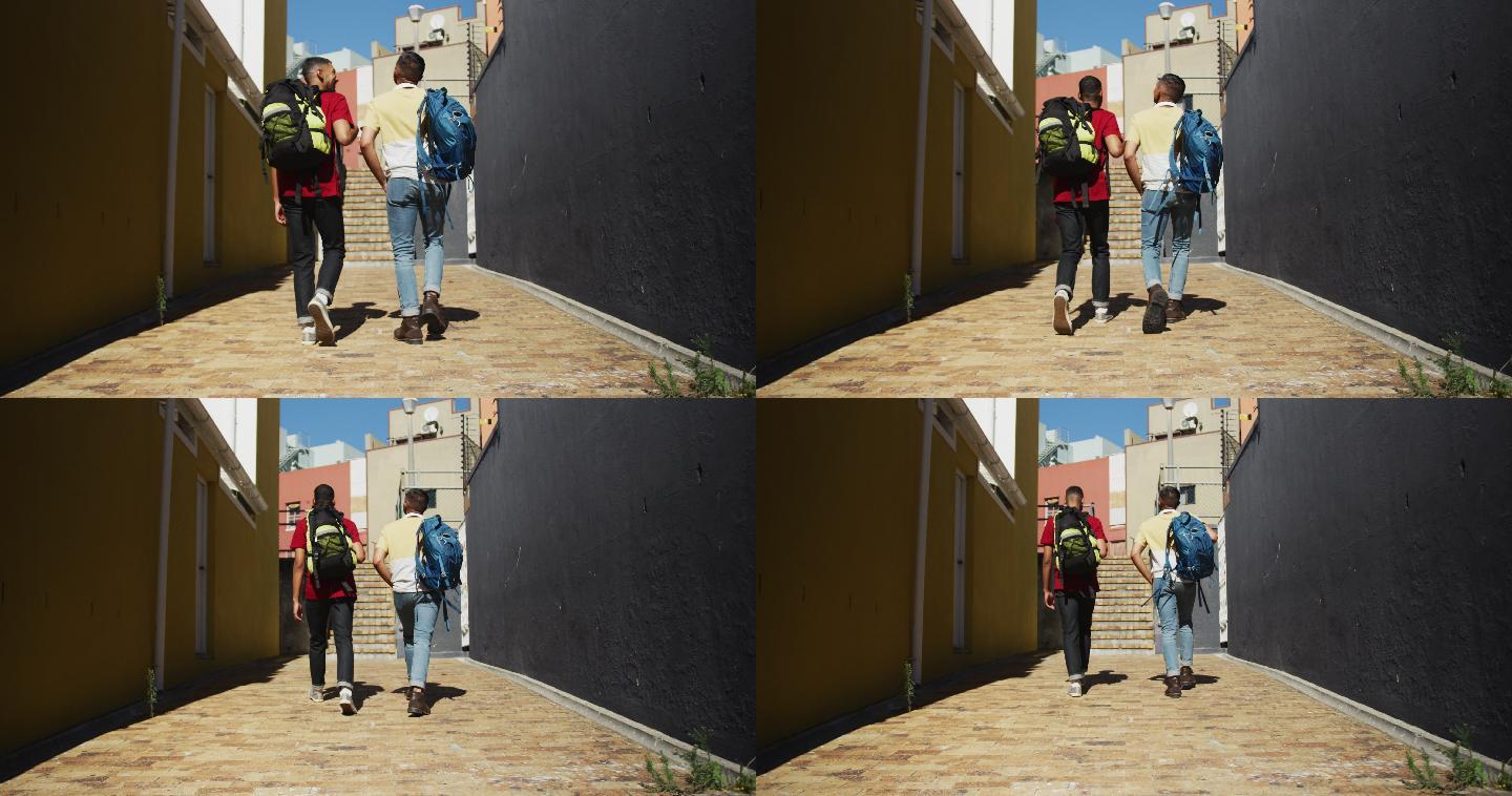 两个混血男性朋友走在街上的后视图