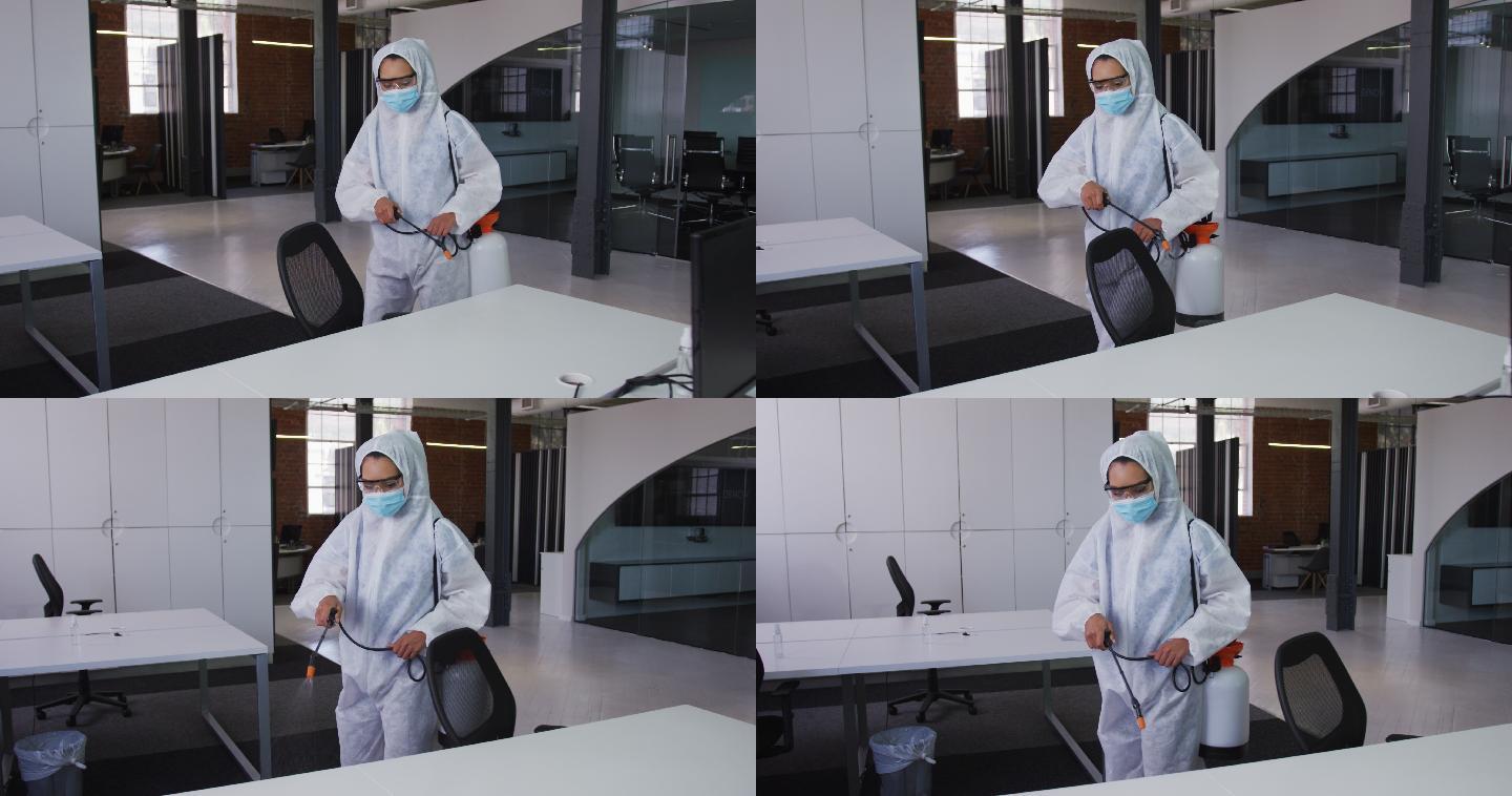 女清洁工戴着防护口罩和工作服对办公室和家具进行消毒