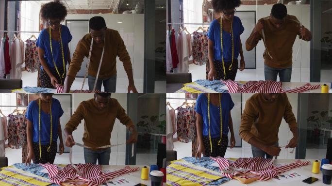 非裔美国男性和女性时装设计师正在测量衣服的尺寸