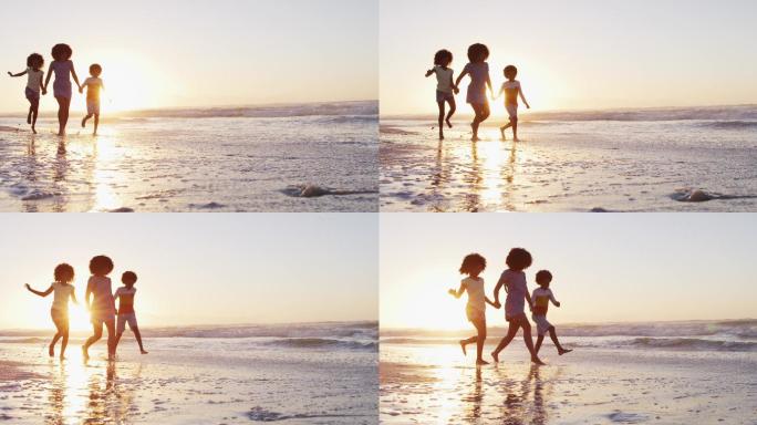 在海滩上，一对美籍黑人夫妇与他们的孩子玩耍