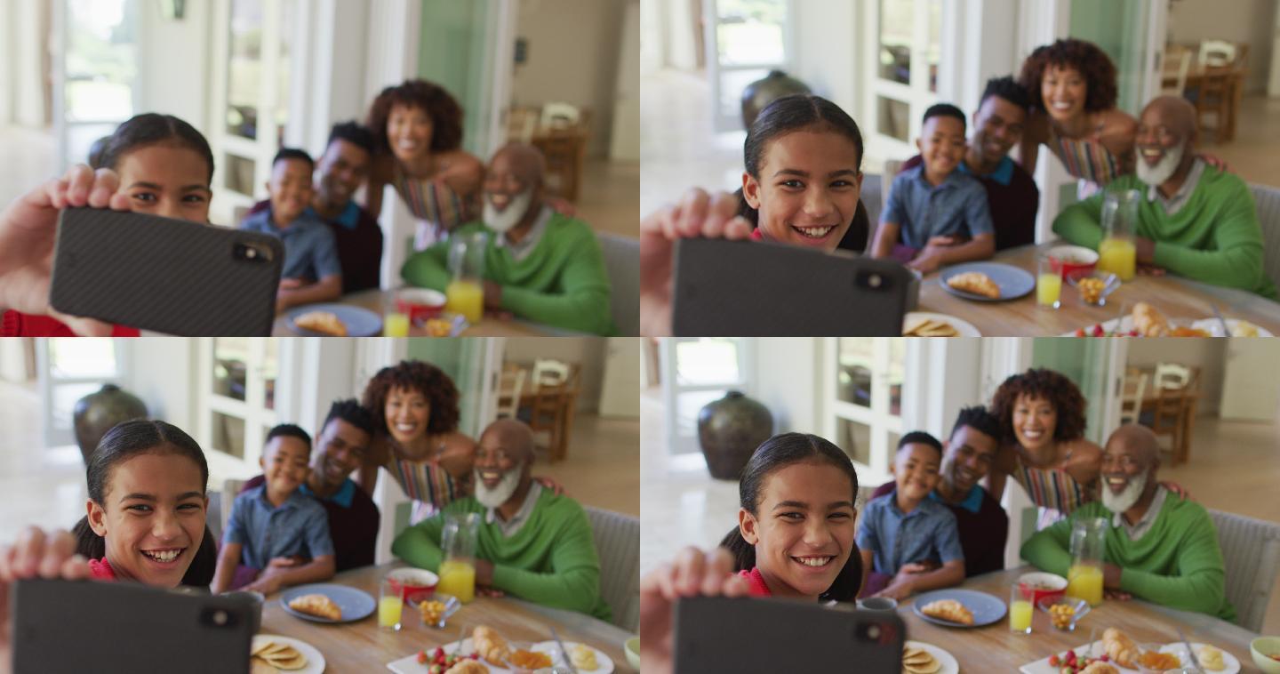 非裔美国女孩和家人在家里吃早餐时自拍