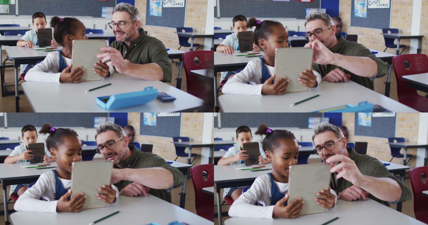 不同的男老师帮助坐在教室里的女学生使用平板电脑