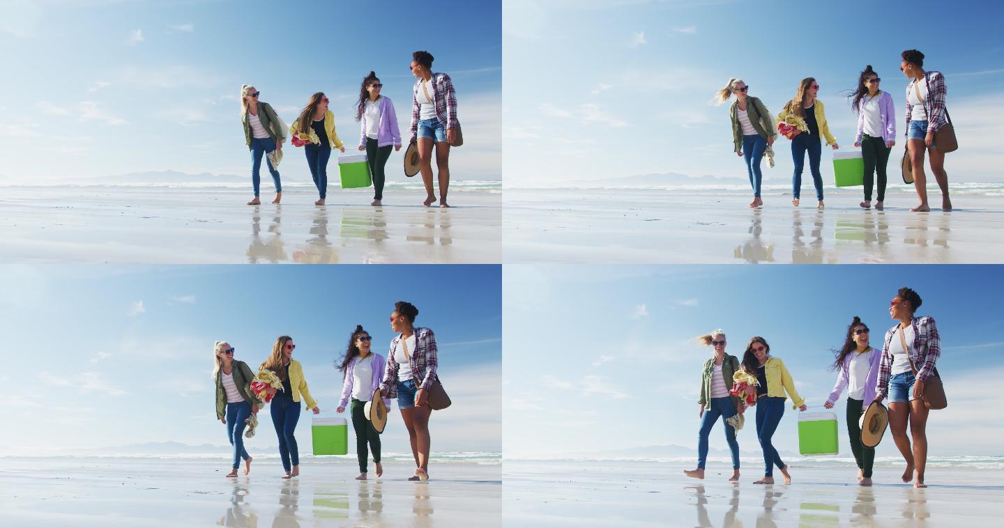 快乐的一群不同的女性朋友有乐趣，沿着海滩散步