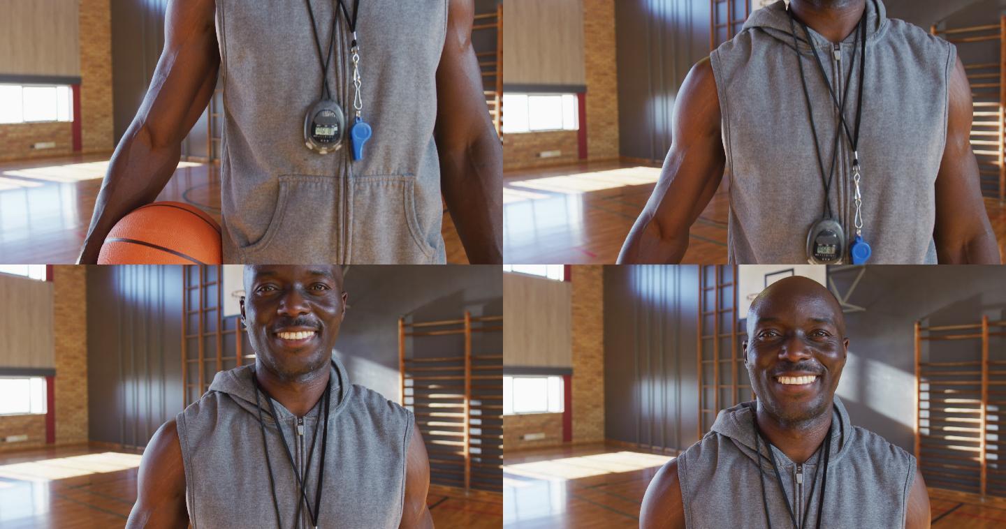 非裔美国男篮球教练的肖像抱球微笑