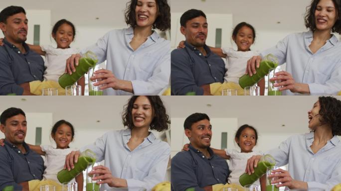 幸福的西班牙家庭，女儿喝绿色奶昔