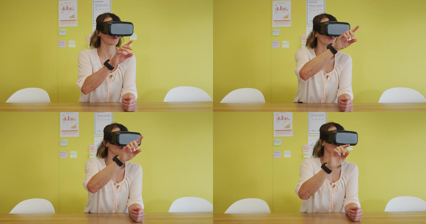 白人女商人坐在办公桌前，测试虚拟现实谷歌