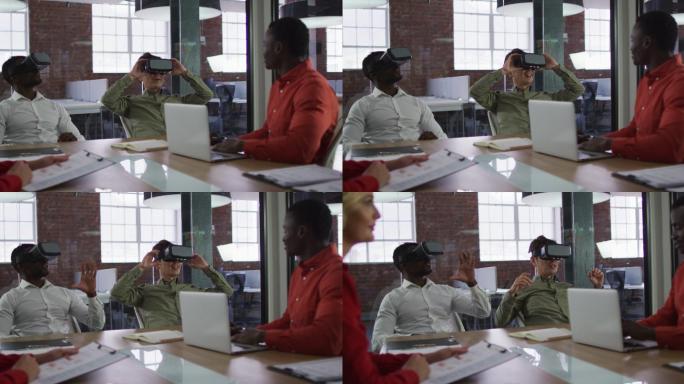 不同的业务团队的同事坐在会议室使用虚拟现实头盔