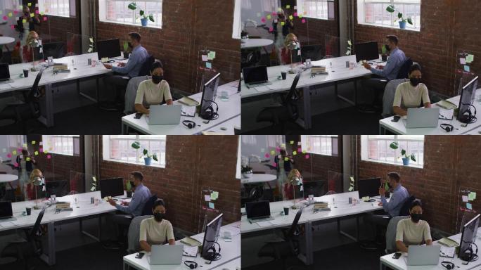 各种各样的男性和女性同事戴着口罩，用笔记本电脑和智能手机通话