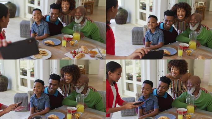 非裔美国女孩和家人在家里吃早餐时自拍