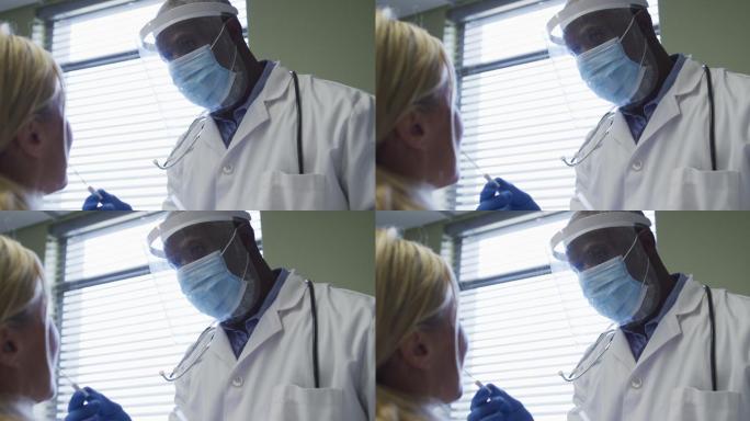 多名女性患者和医生戴口罩进行covid - 19拭子检测
