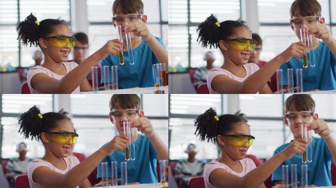 不同种族的学童戴着防护眼镜，在化学课上拿着试管