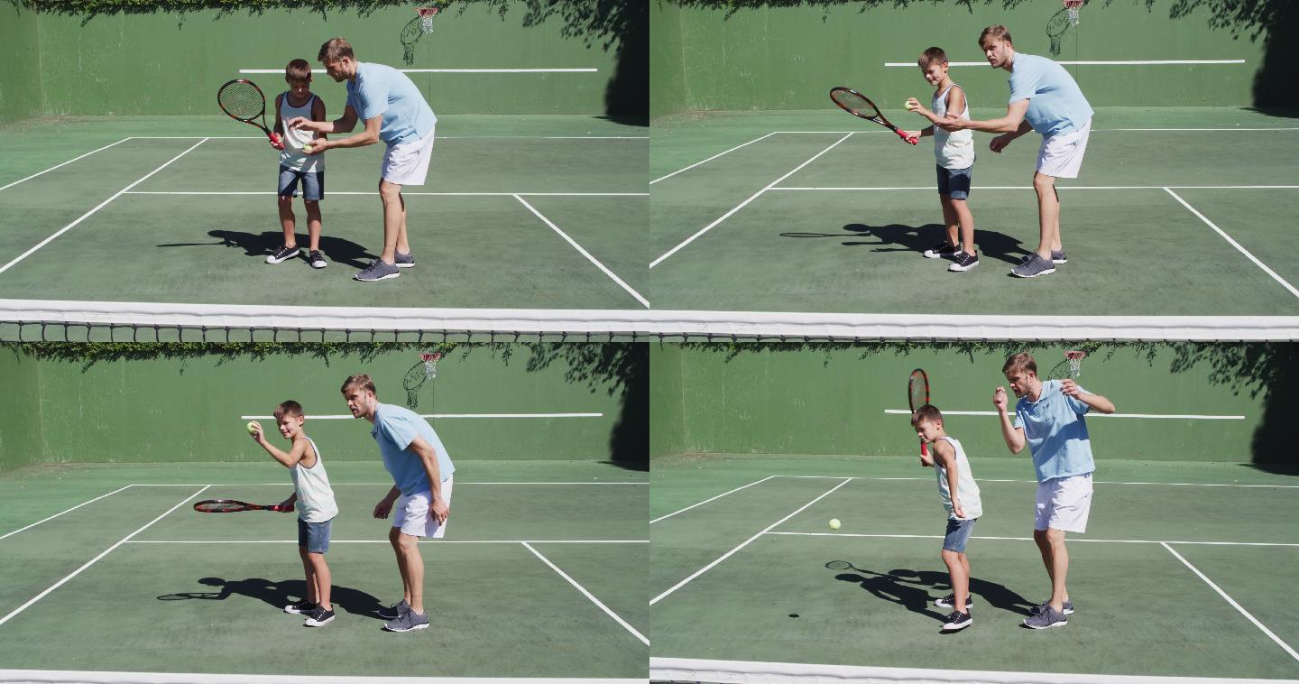 一个白人父亲在一个阳光明媚的日子在网球场教他的儿子打网球