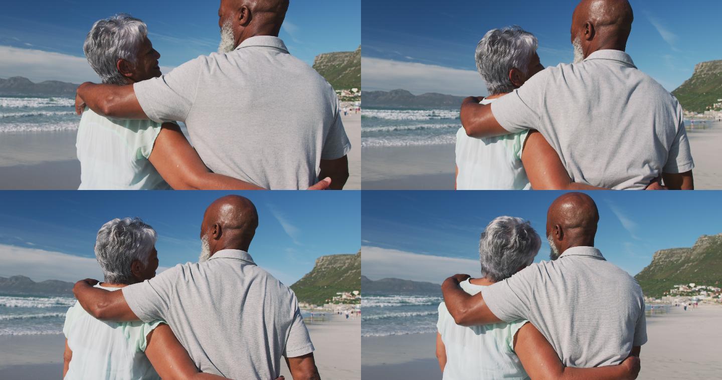 一对非洲裔美国老夫妇在海滩上拥抱