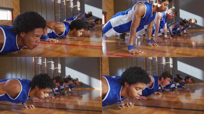不同类型的男子篮球队穿着蓝色运动服，做俯卧撑