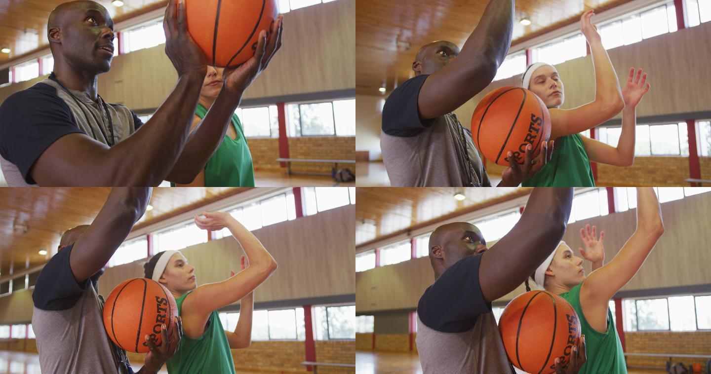 多样化的女篮球运动员和男教练练习投篮