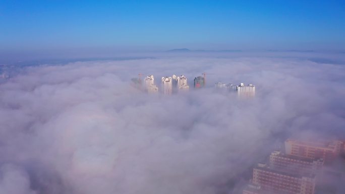 云雾中的小城楼宇航拍4K素材B段