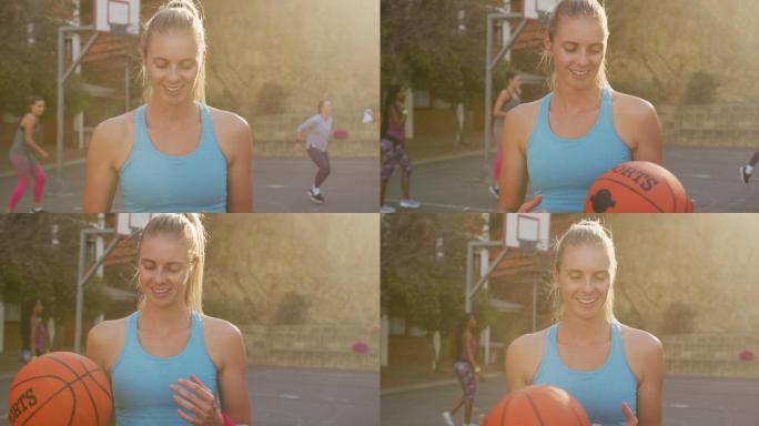 白人女篮球运动员的肖像，拿着球，看着相机
