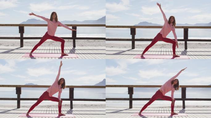 健康的混血女子在户外练习瑜伽，站在海边伸展身体