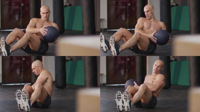 健康的白人男子在健身房用健身球练习腹肌