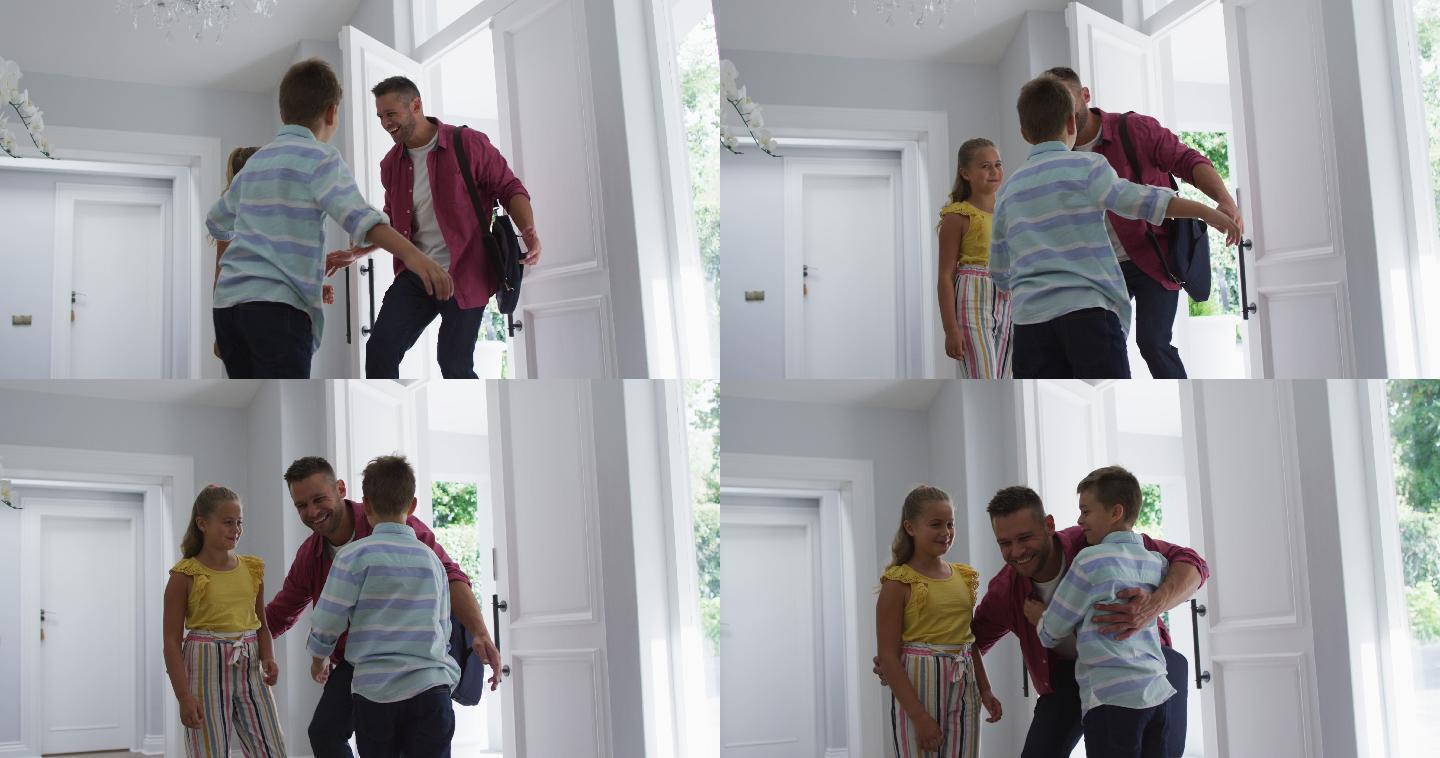 兴奋的白人儿子和女儿在家里跑着，拥抱着父亲从前门进来