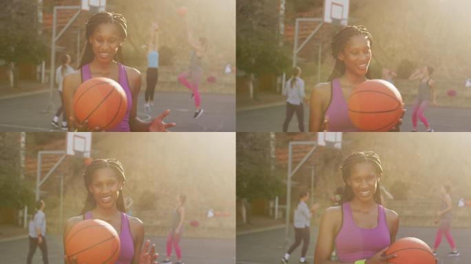 非裔美国女篮球运动员的肖像，拿着球，看着照相机