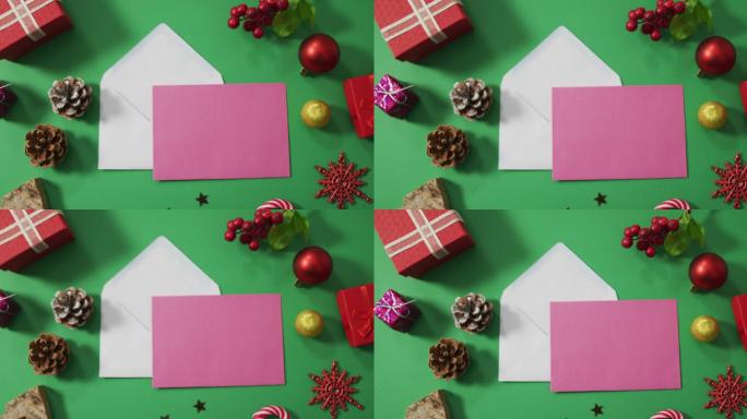 圣诞装饰与信封和拷贝空间的绿色背景