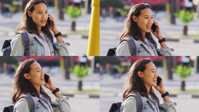 亚洲女性用智能手机聊天，面带微笑