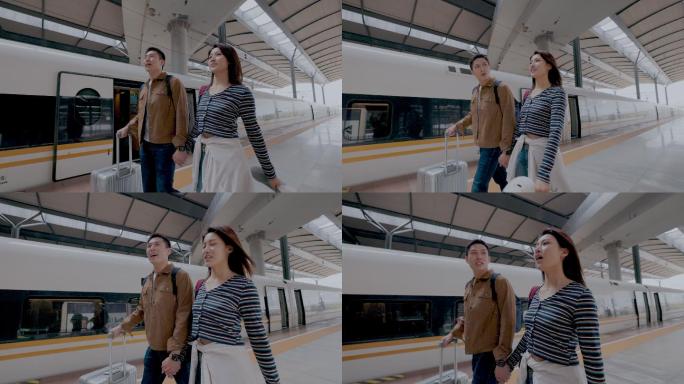 高铁站内快乐的年轻伴侣