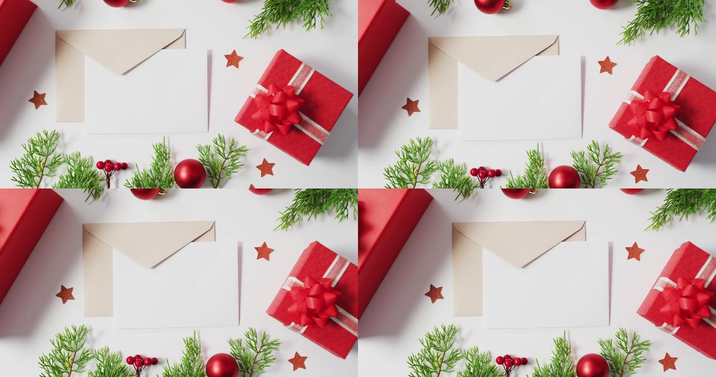 红色圣诞装饰的视频，白色背景上的信封